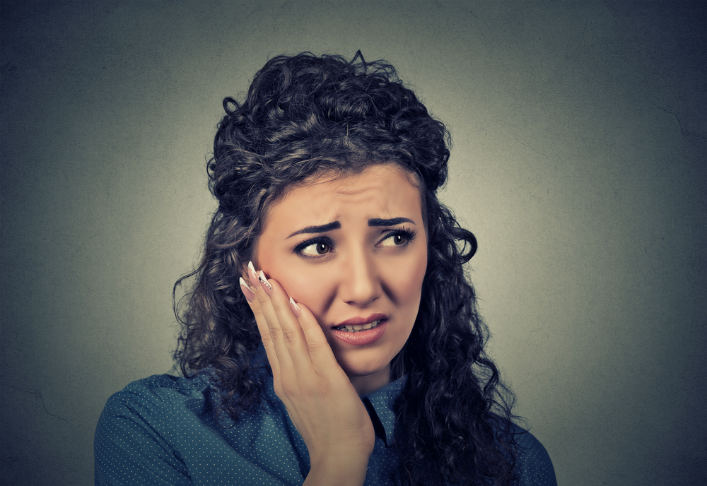 why does my crowned tooth hurt causes and relief tips